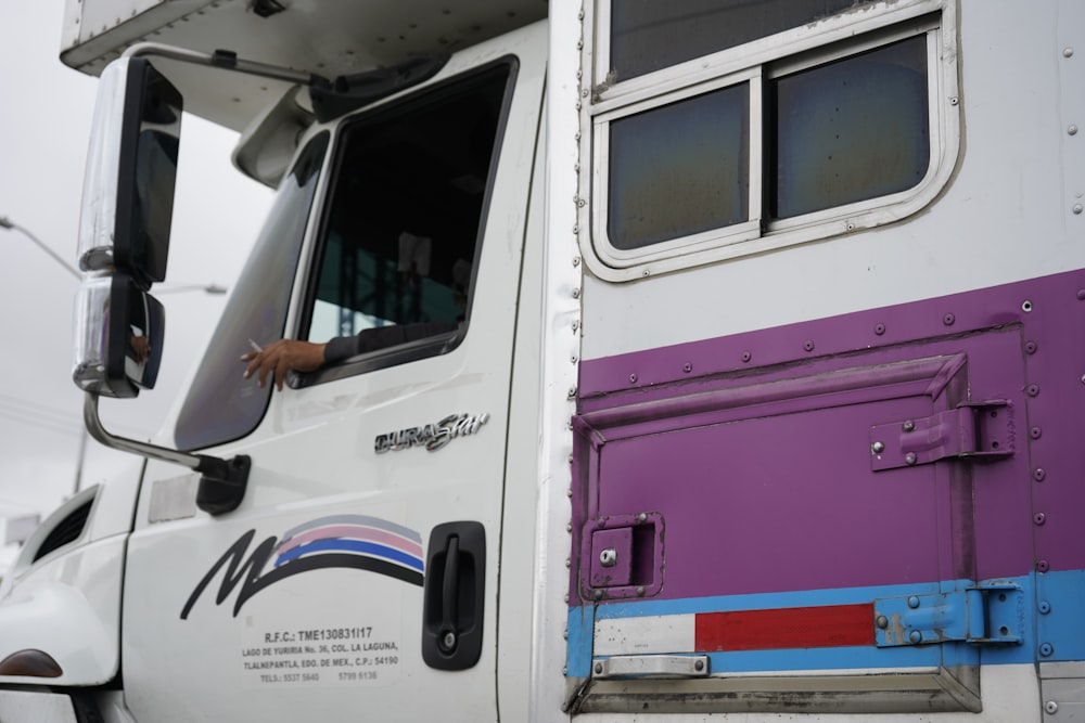 white and pink van during daytime