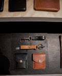 brown leather wallet on black textile