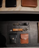 brown leather wallet on black textile