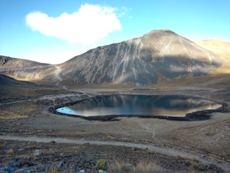 lake in the middle of the mountains