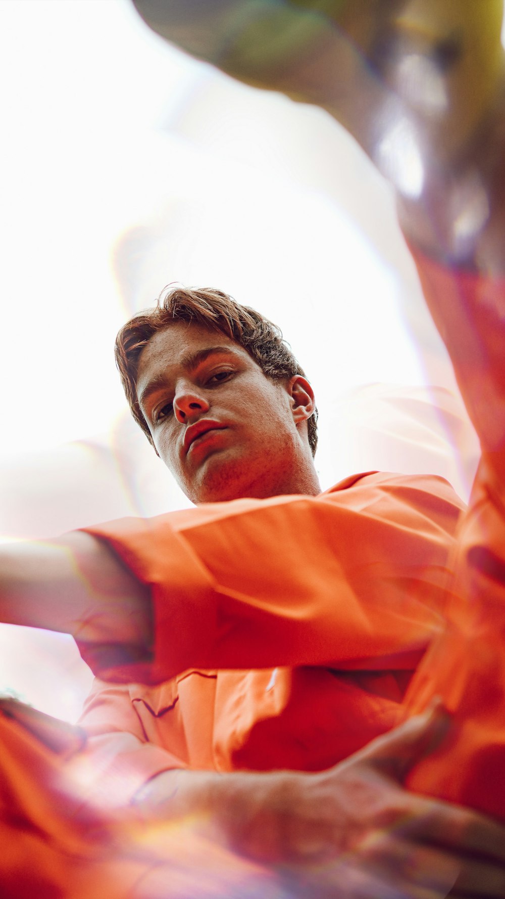 man in orange dress shirt