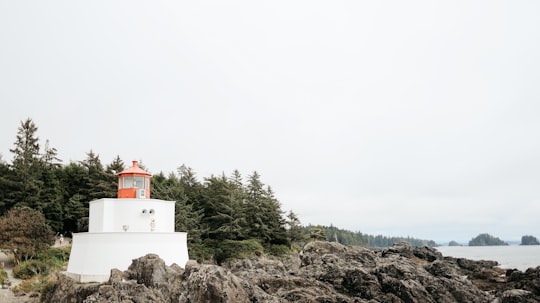 white and red concrete building on rocky hill during daytime in Ucluelet Canada