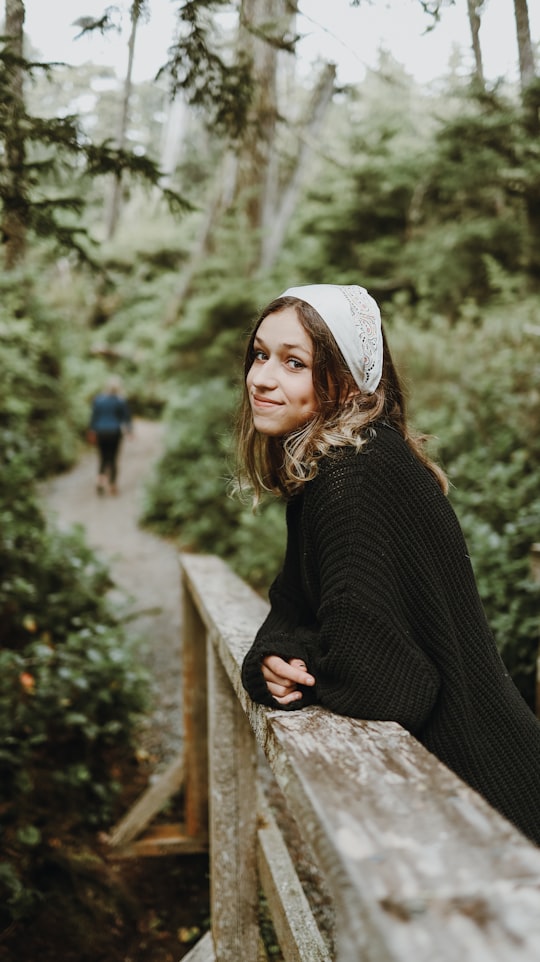 woman in black sweater and white cap in Ucluelet Canada