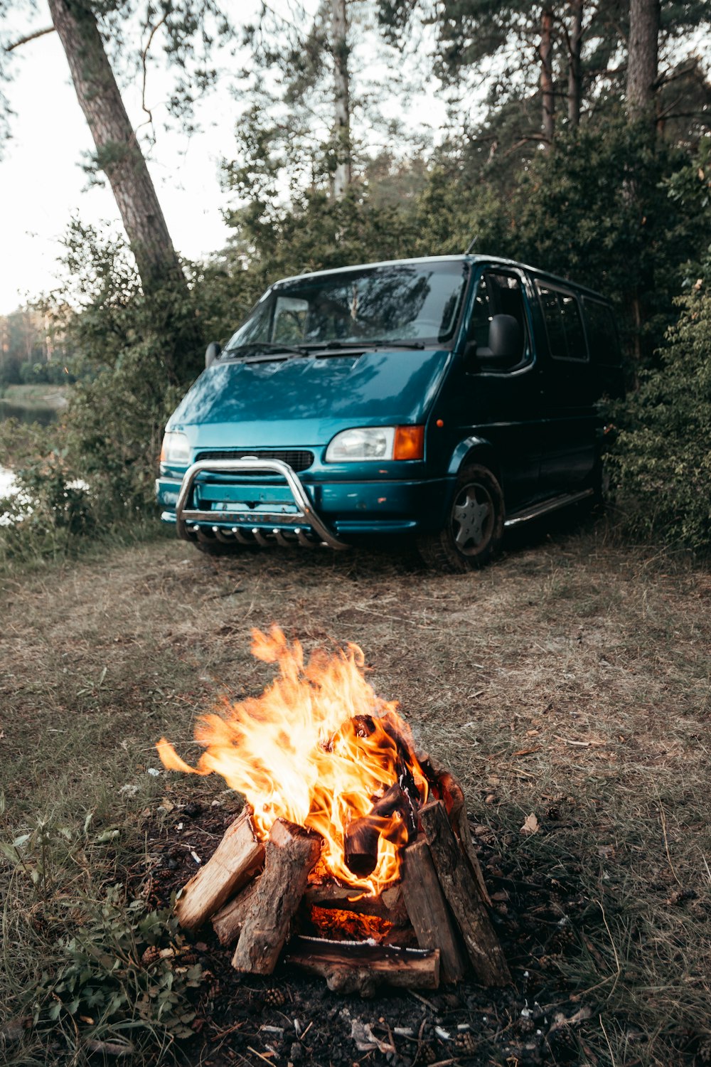 blue car on brown soil