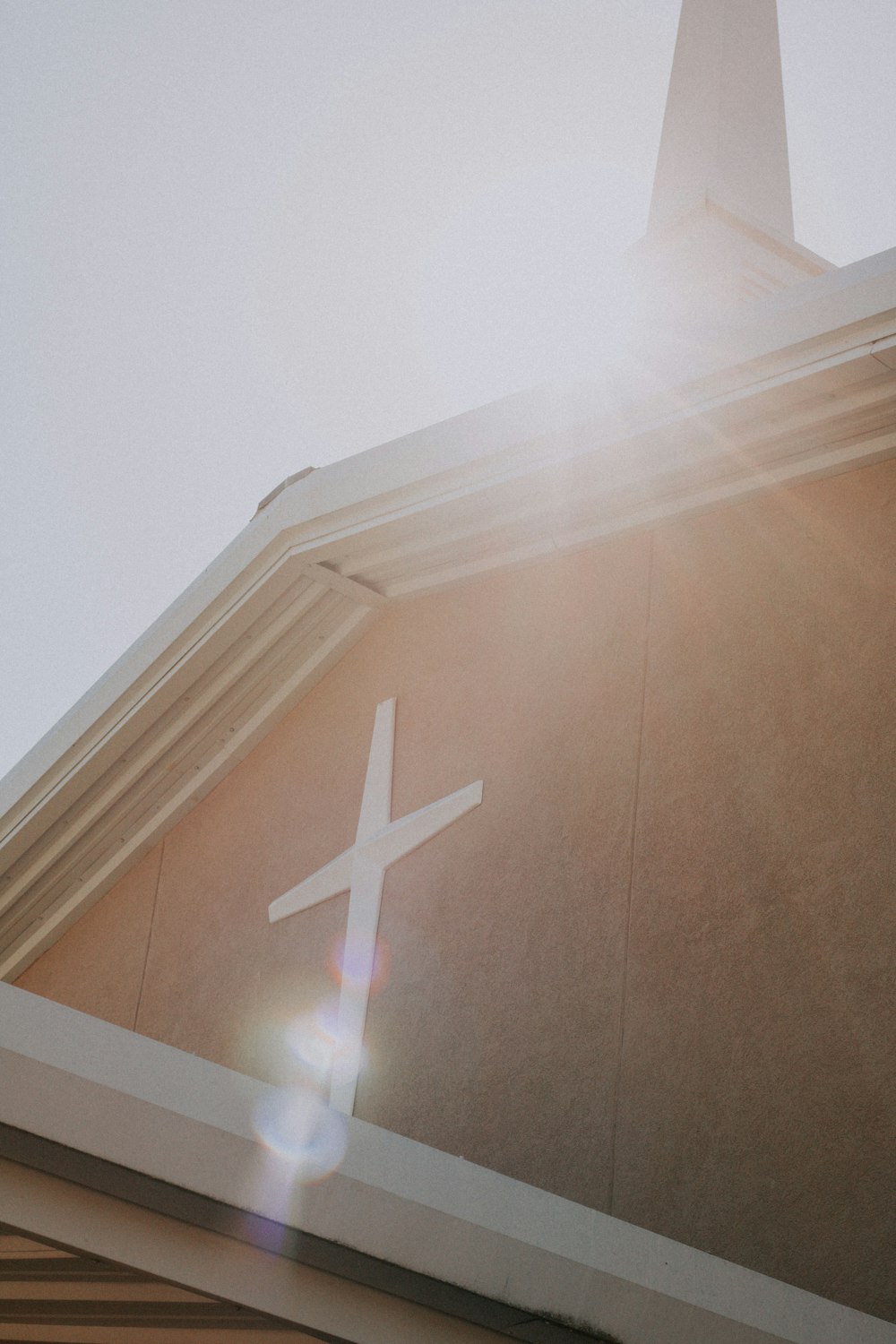 white cross on brown wall