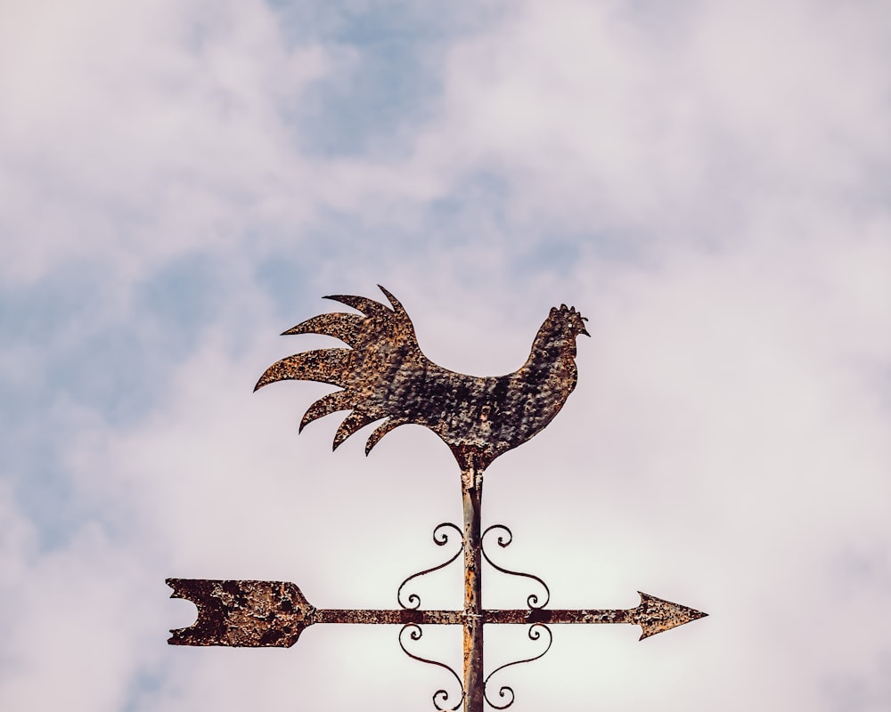 brown dragon on brown wooden cross