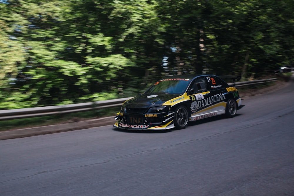 black and yellow porsche 911 on road during daytime