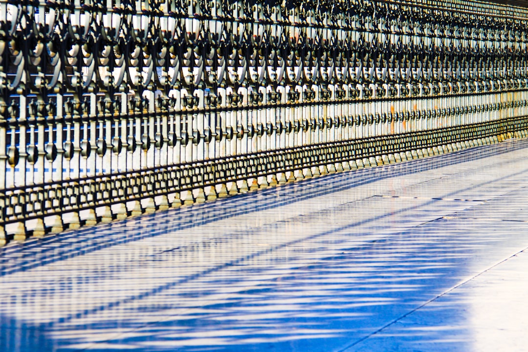 white metal fence on blue floor