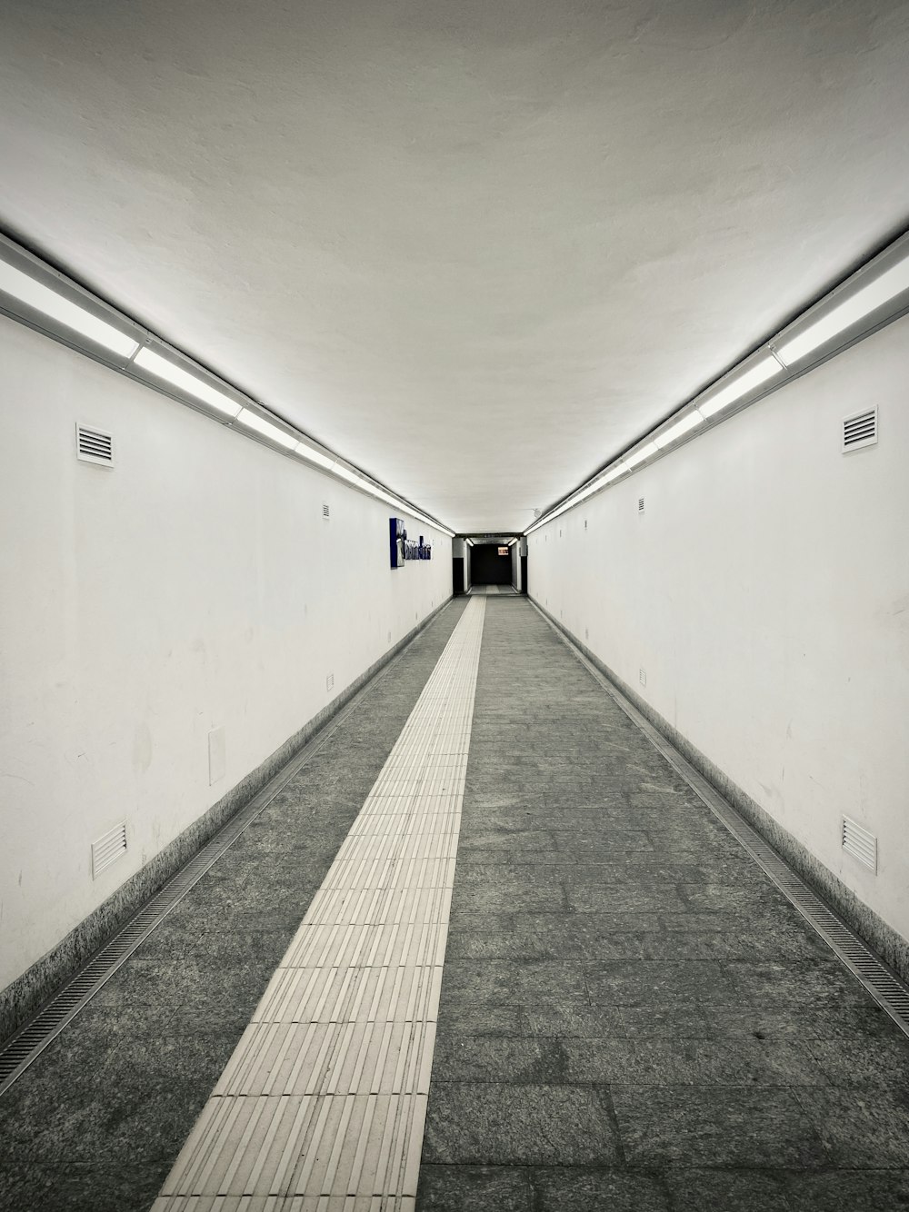 white and gray hallway with white walls