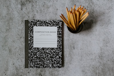 black and white book on gray marble table