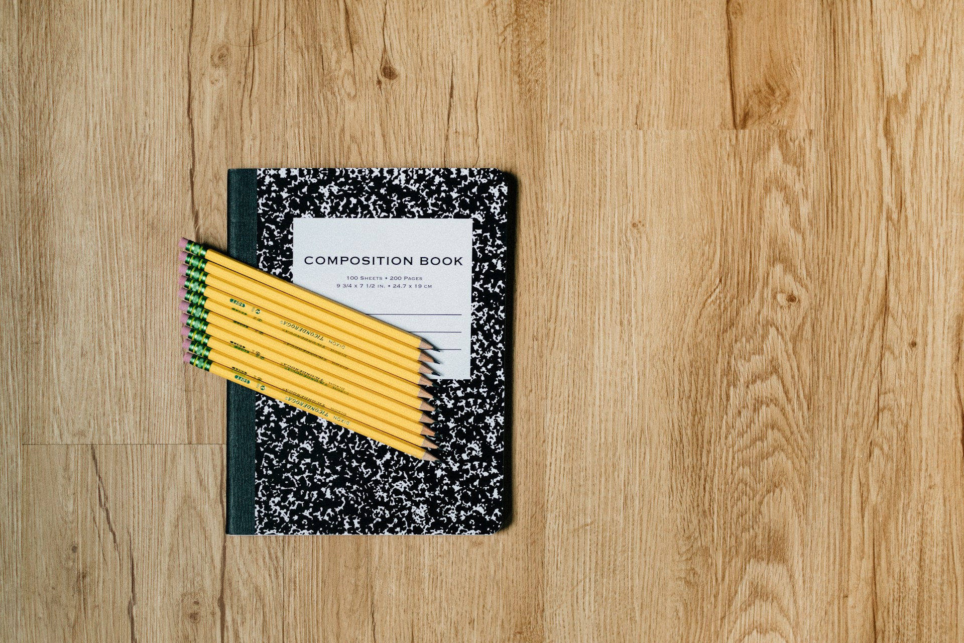 white and black card on brown wooden table