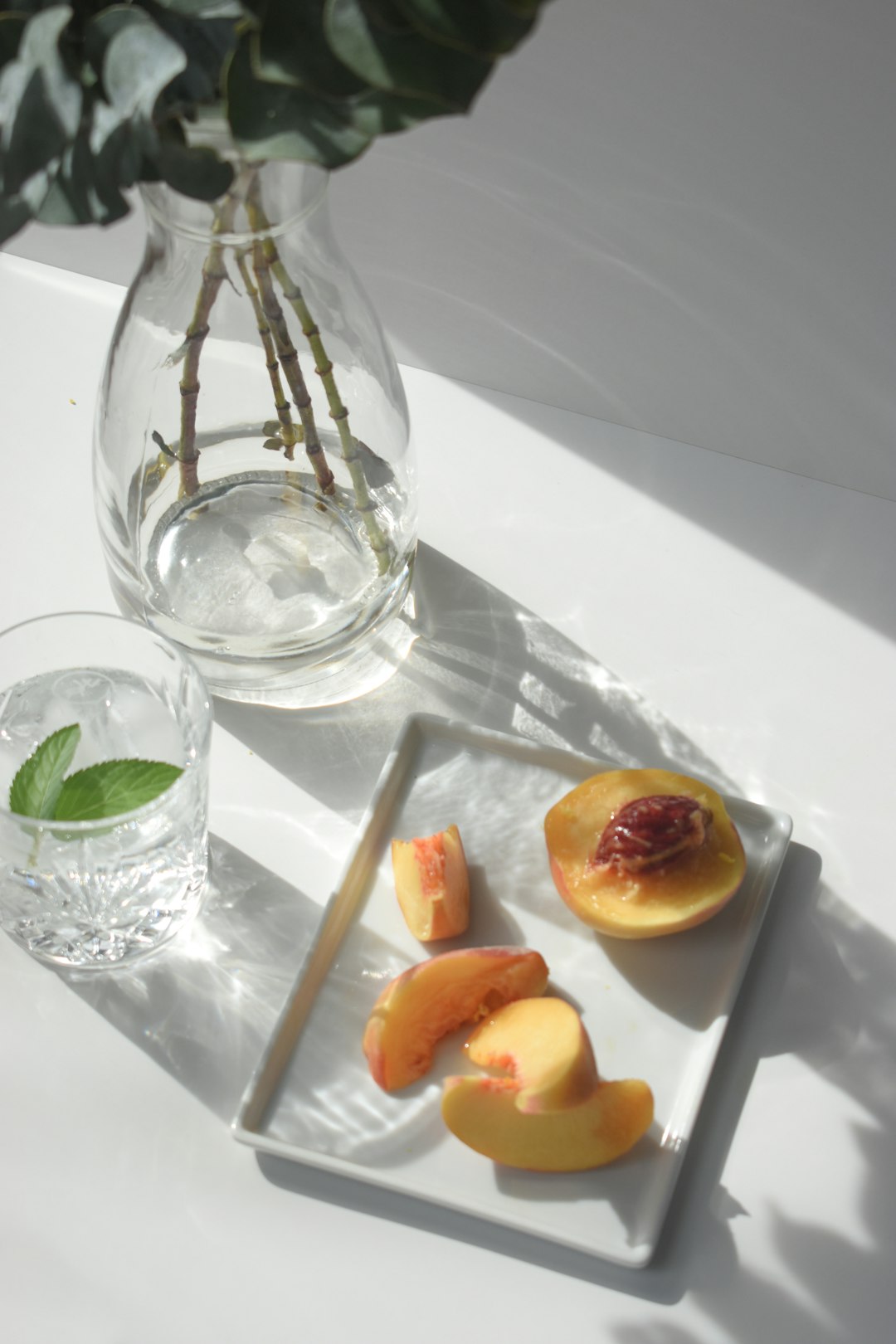 sliced fruit on white ceramic plate