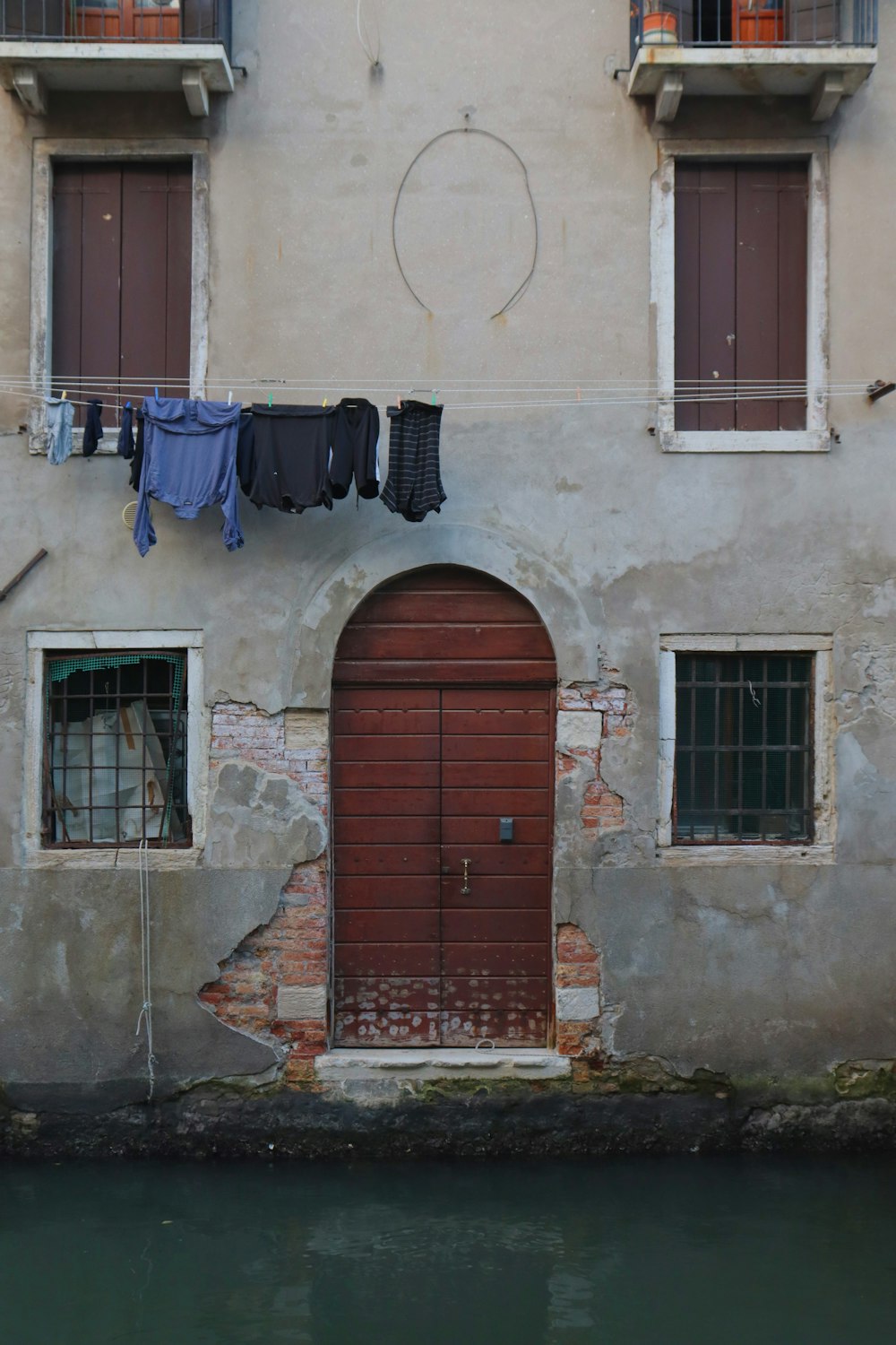 brown wooden door on brown concrete building