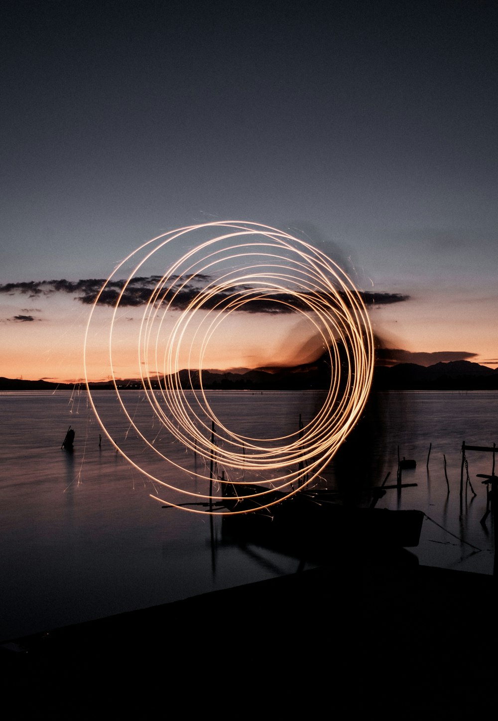 time lapse photography of lights on body of water during night time