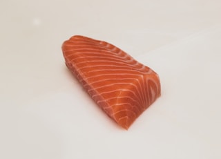 sliced fish meat on white surface