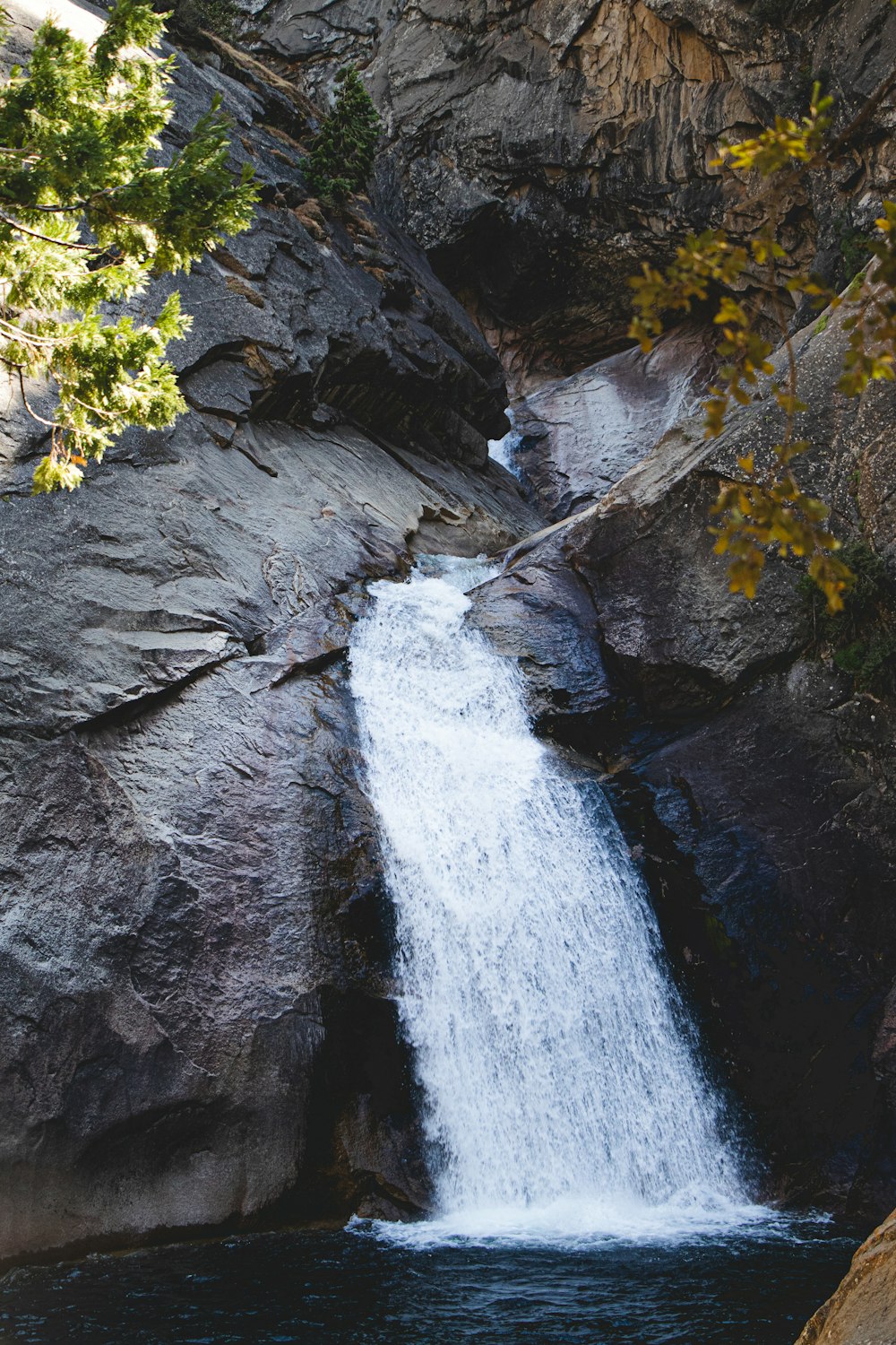 water falls on black rock