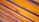 Smooth wooden planks arranged horizontally with visible grain and a warm, polished finish.