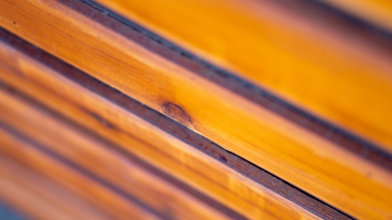 Smooth wooden planks arranged horizontally with visible grain and a warm, polished finish.