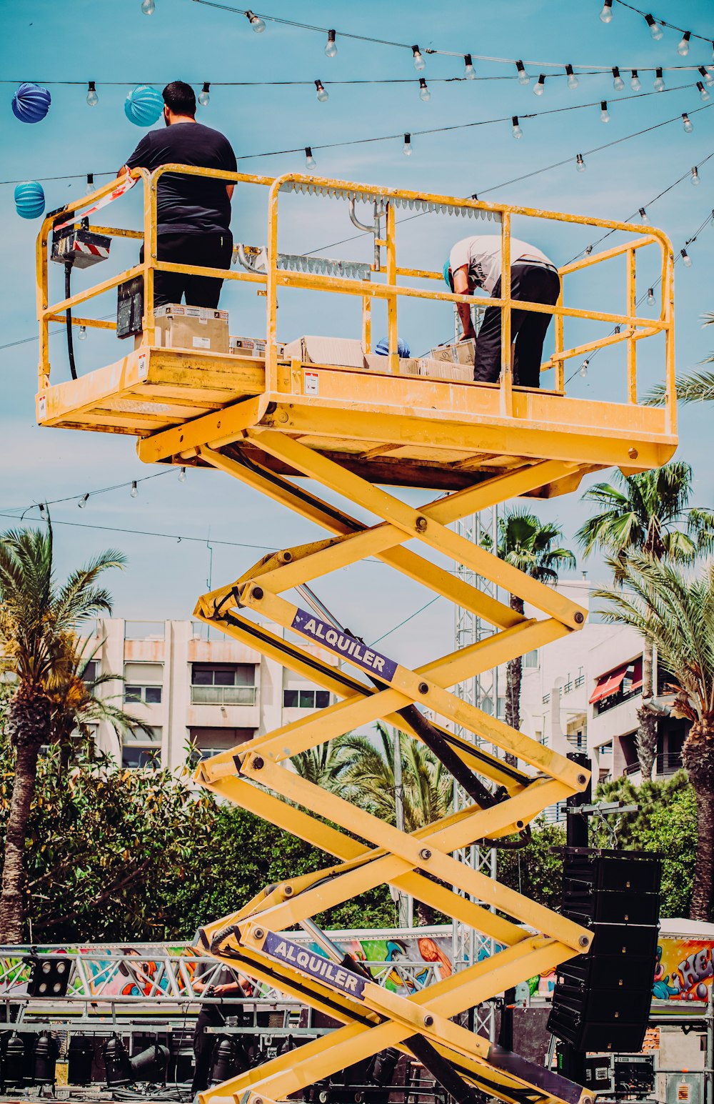 man in black t-shirt and black pants riding yellow and black roller coaster during daytime