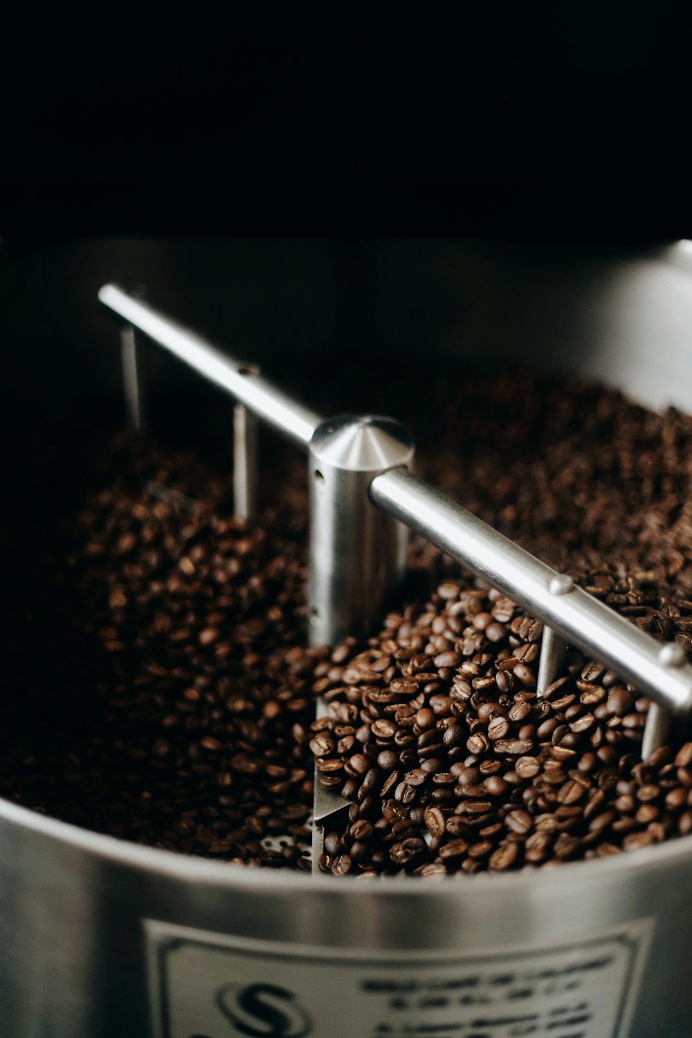 coffee beans on stainless steel round tray