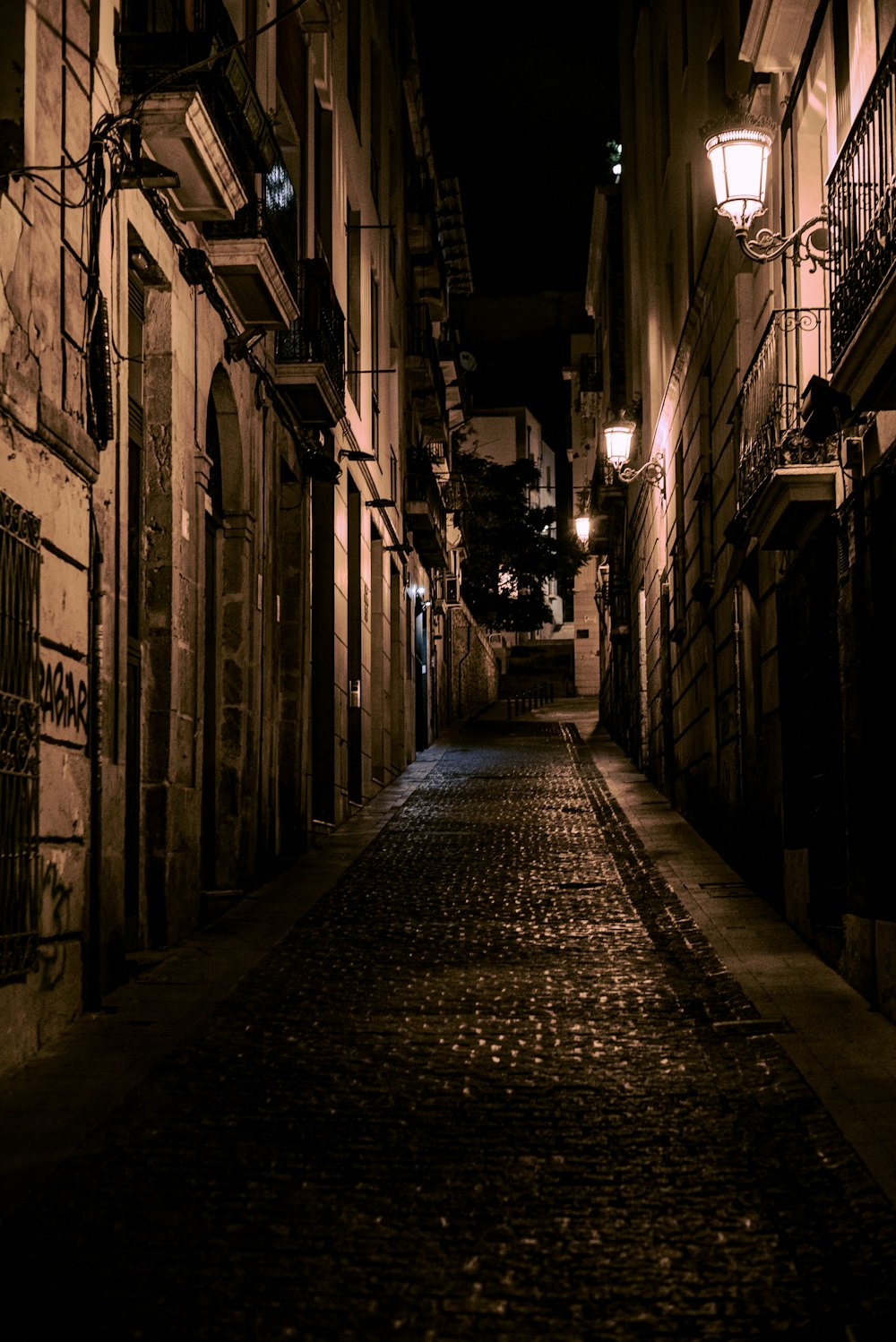 empty hallway with lighted lamps