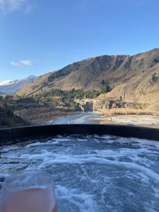 Guests enjoying a peaceful spa session with scenic mountain views.