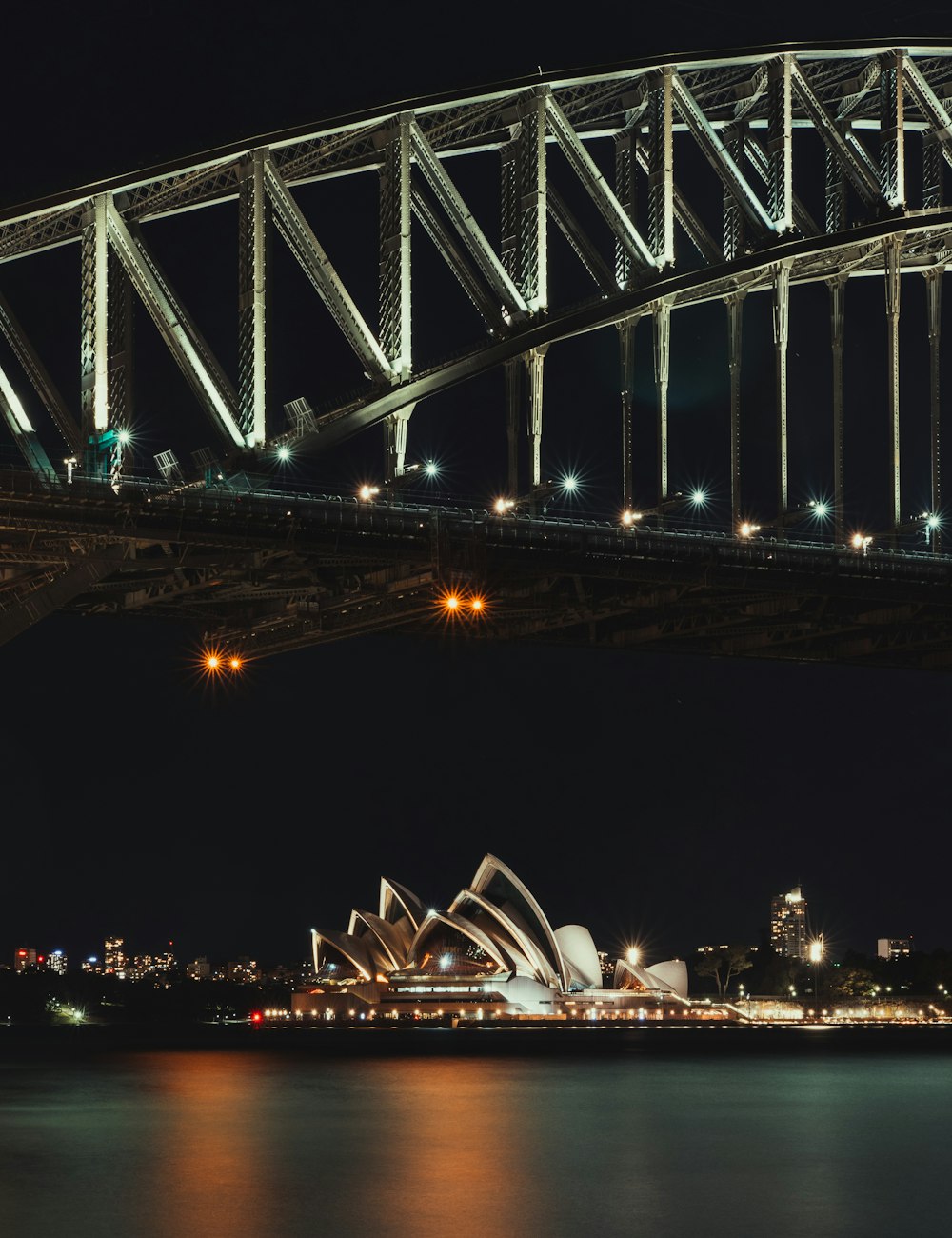 white and black bridge during night time