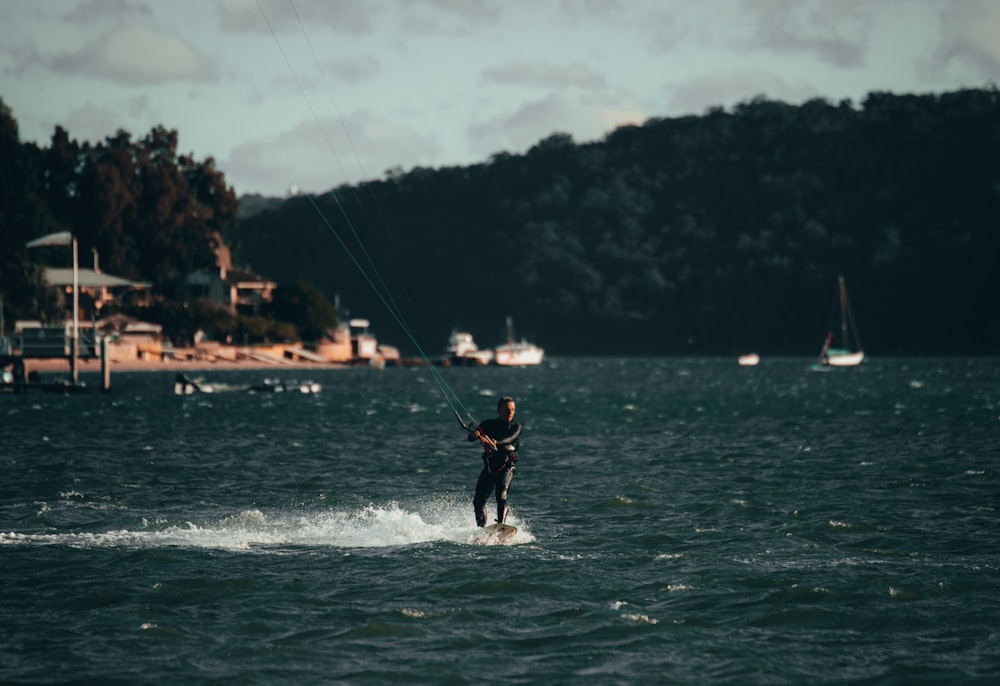 person surfing on sea during daytime