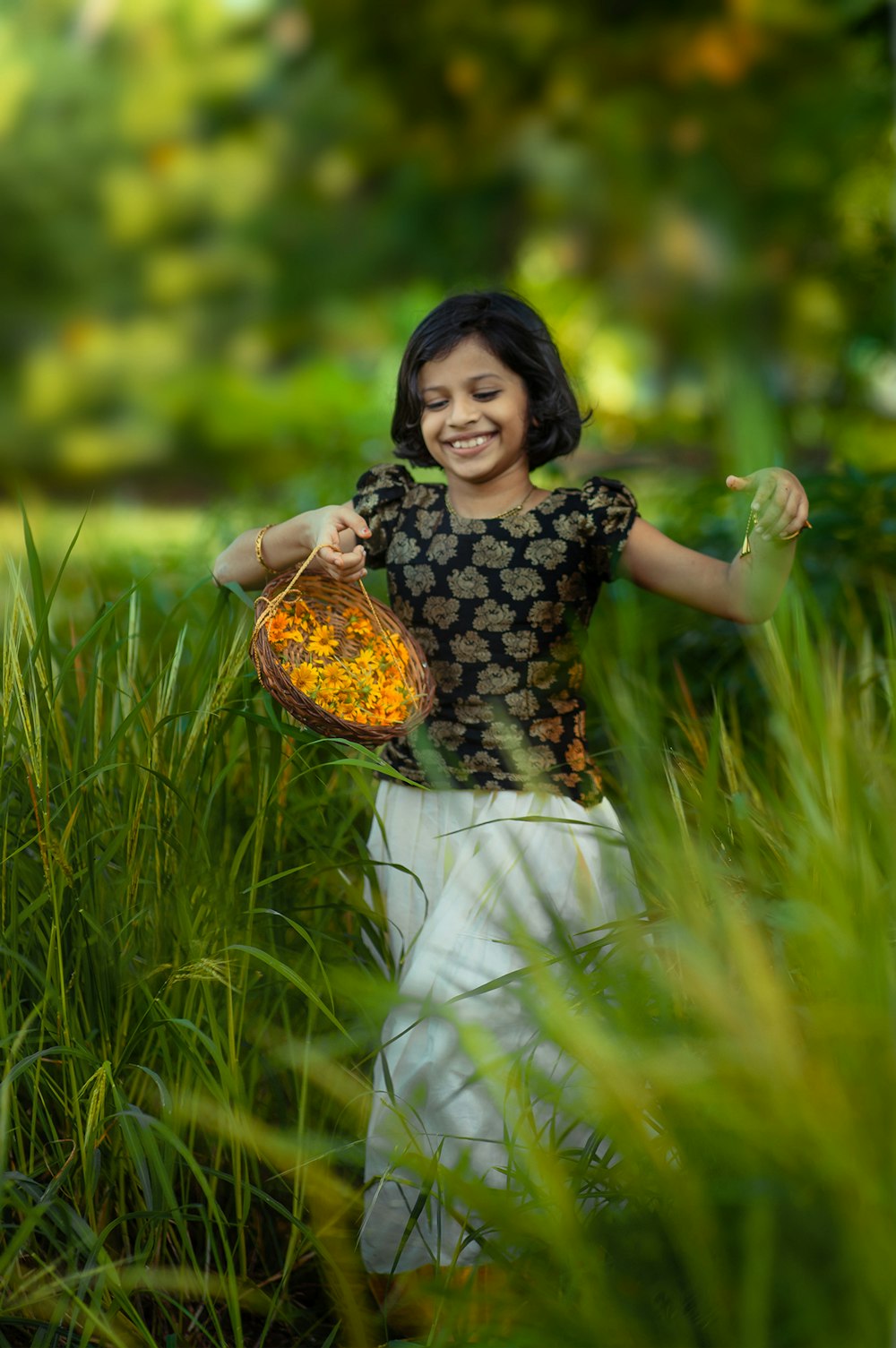 a woman holding a basket in a field of tall grass