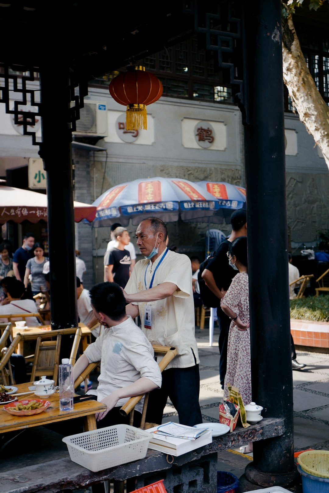 man in white shirt sitting on chair beside woman in white shirt