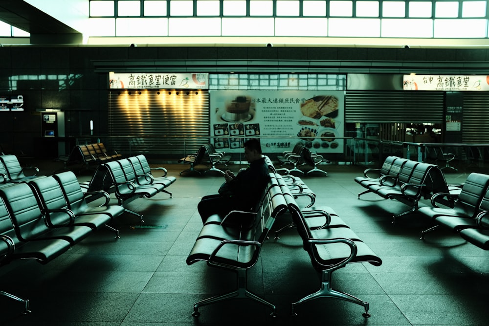 people sitting on chair inside room