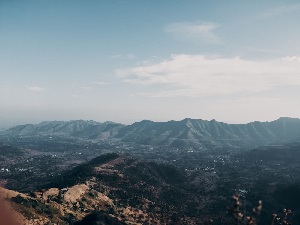 green and brown mountains under blue sky during daytime