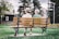 A happy couple sitting together on a park bench, smiling and enjoying each other's company.