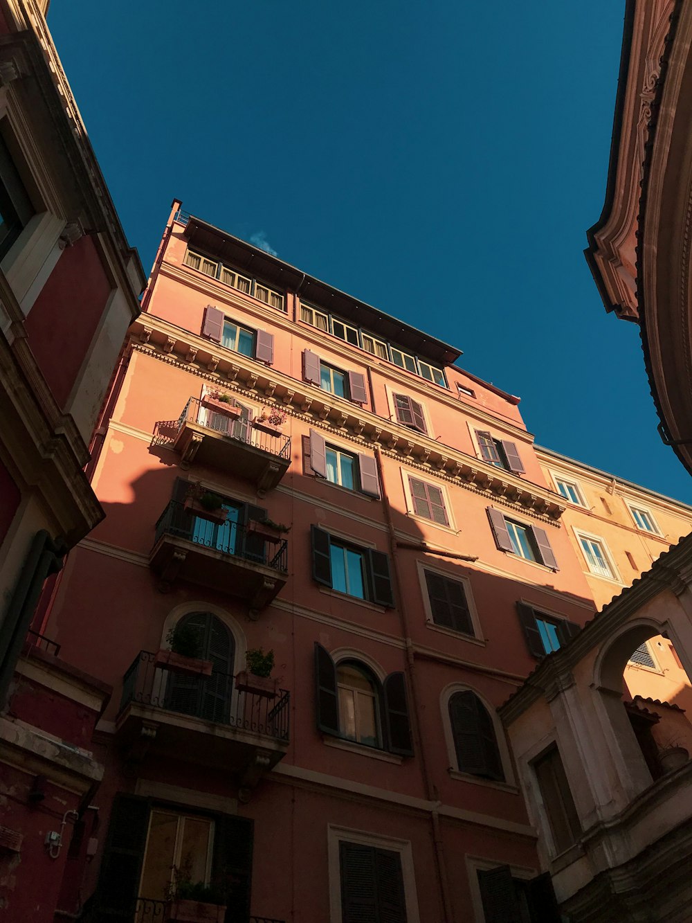 brown concrete building under blue sky during daytime