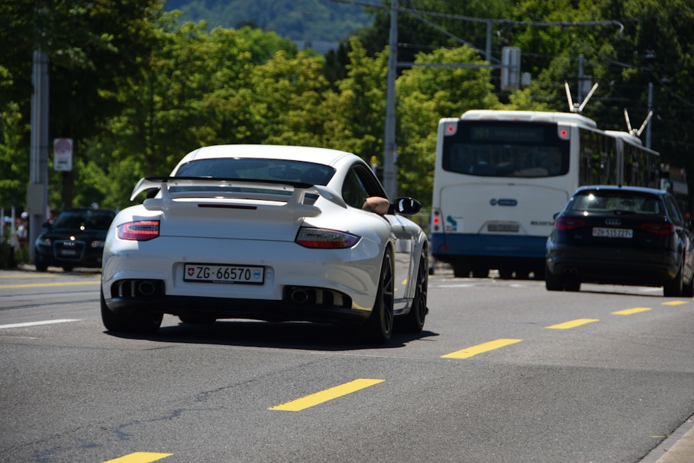 white porsche 911 on road during daytime