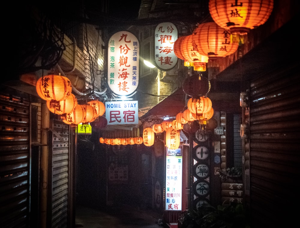 orange pendant lamps turned on during nighttime