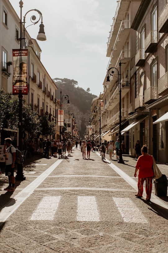 people walking on street during daytime in Sorrento Italy