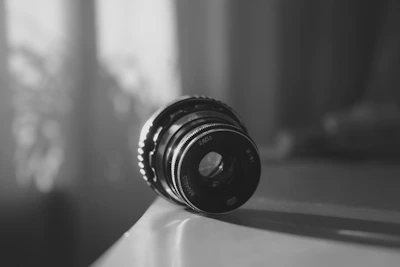 A candid shot of a camera lens catching the morning light, symbolizing fresh perspectives.