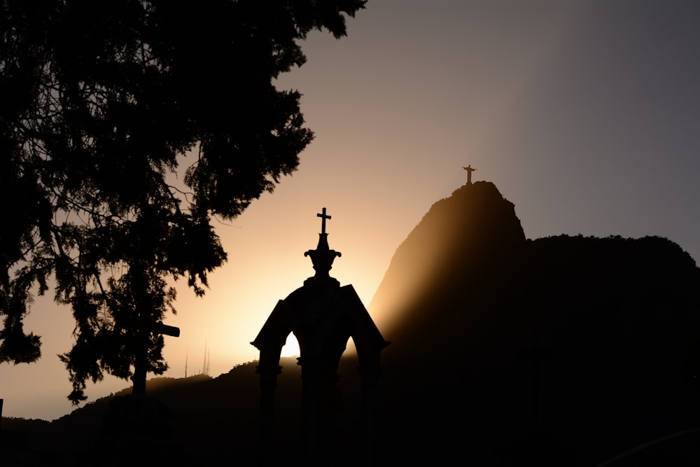 silhouette of statue during daytime