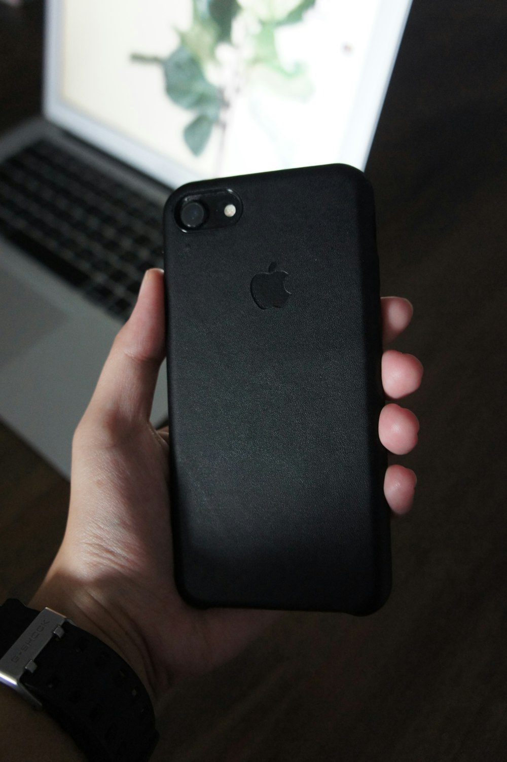 person holding black iphone 7