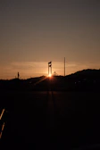 An inspiring sunset behind an industrial plant, symbolizing hope, protection, and continuity.