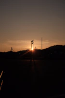 Sunset over an expansive industrial zone highlighting the scale and infrastructure.