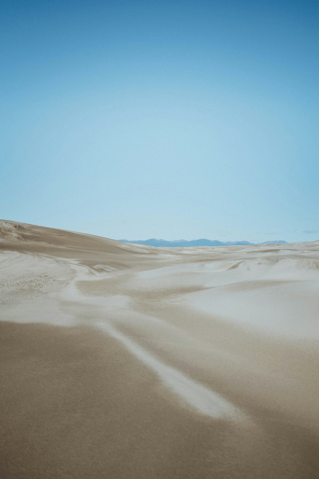 brown sand under blue sky during daytime