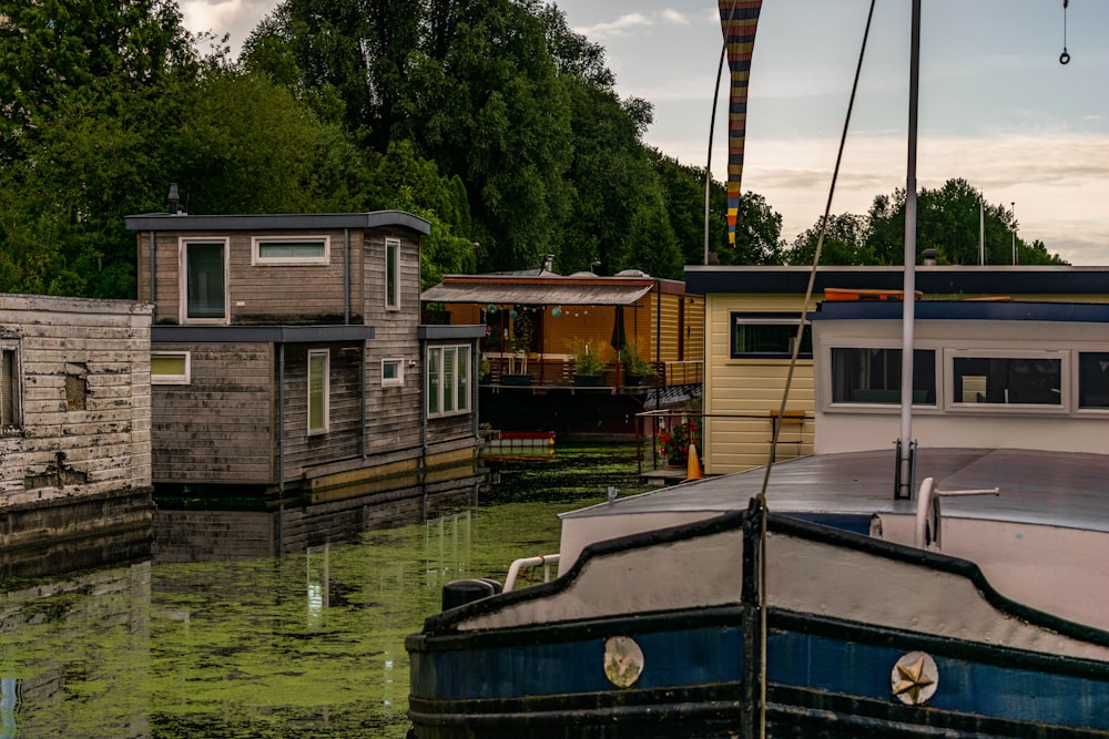 blue and brown wooden boat on body of water