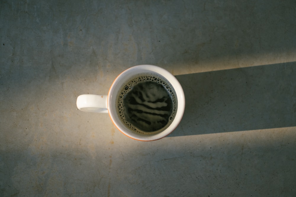 white ceramic mug with coffee