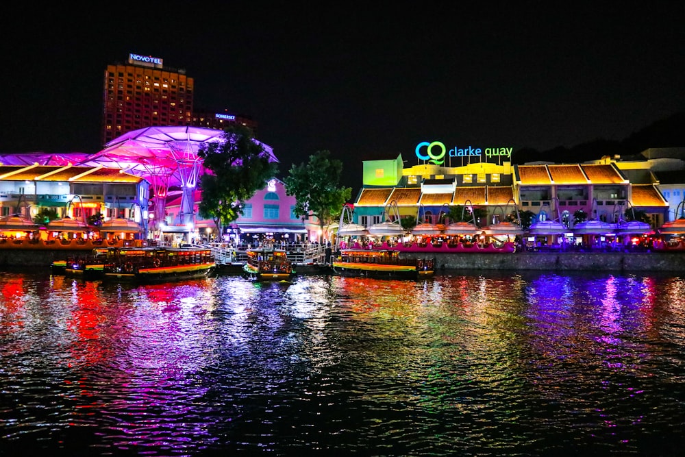 boat on water near building during night time