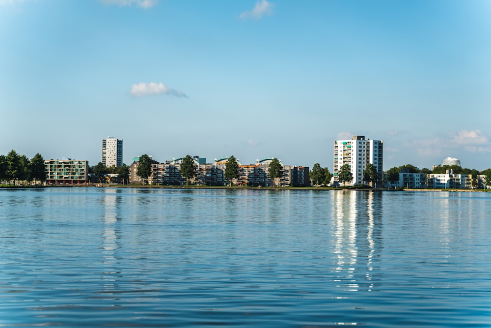 city skyline across body of water during daytime