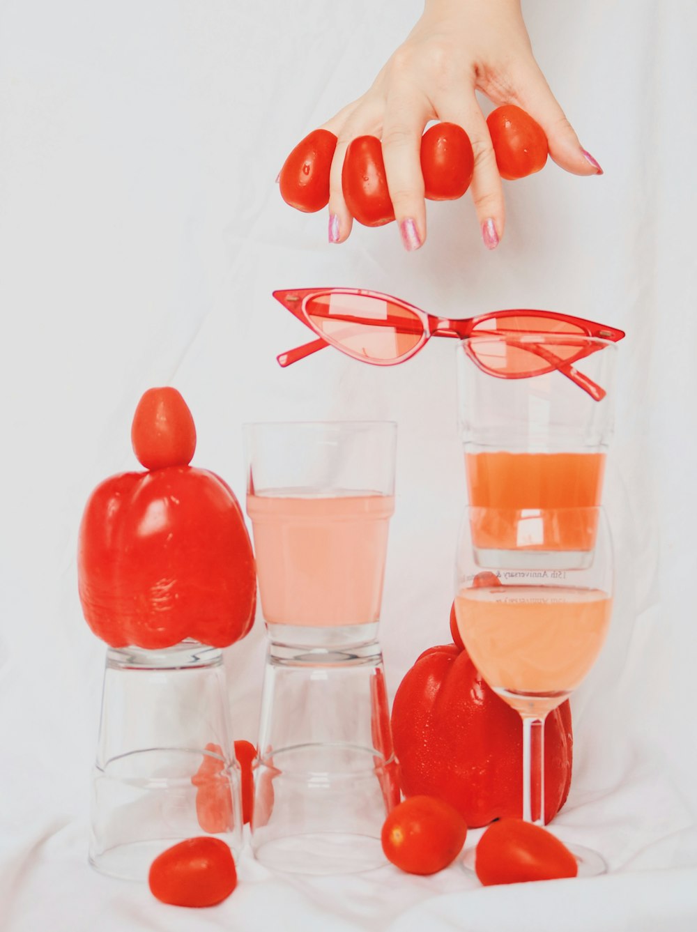 clear drinking glass with pink liquid