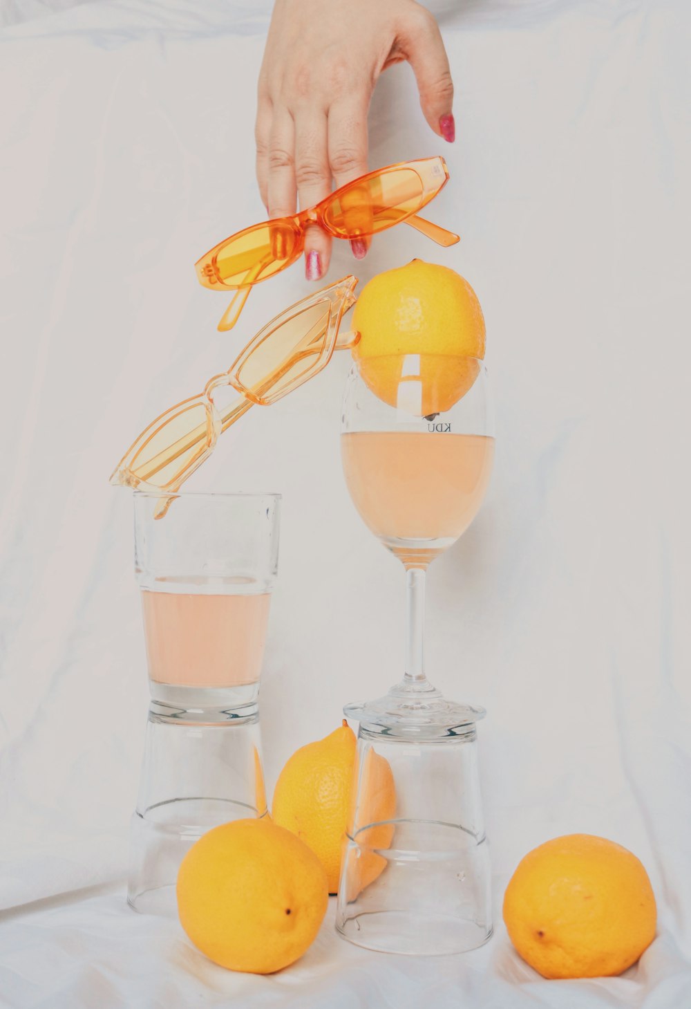 clear drinking glass with orange liquid