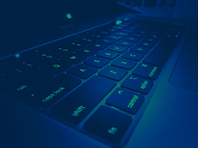 Creative graphic showing keywords floating above a laptop keyboard.